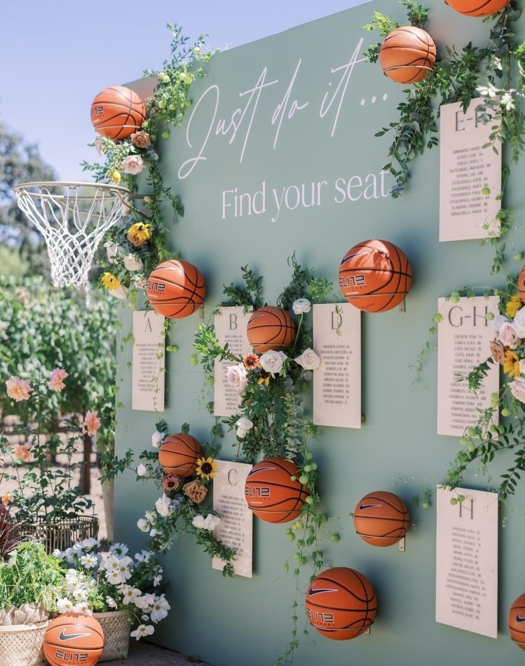 A basketball themed wedding seating chart with a net and full-sized basketballs