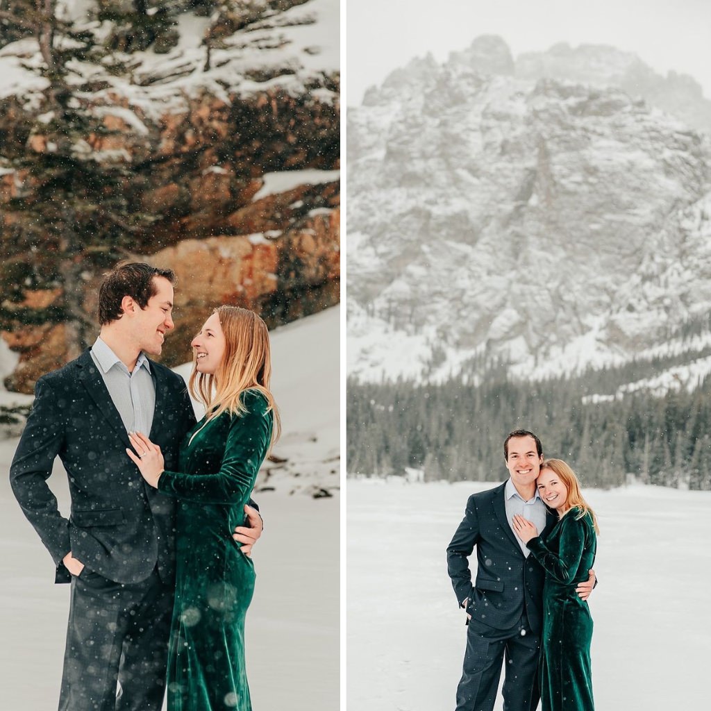 A couple posing for winter engagement photos in the snow. The girl is wearing a green velvet dress.