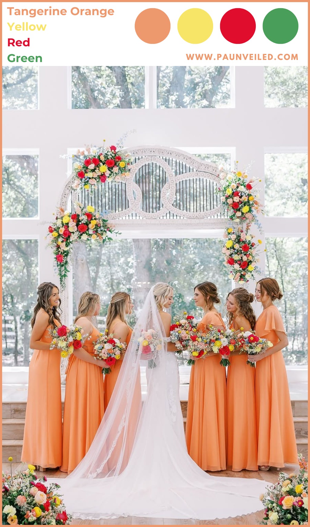 A bride posing indoors with her bridesmaids. The girls are wearing tangerine orange colored dresses for spring.