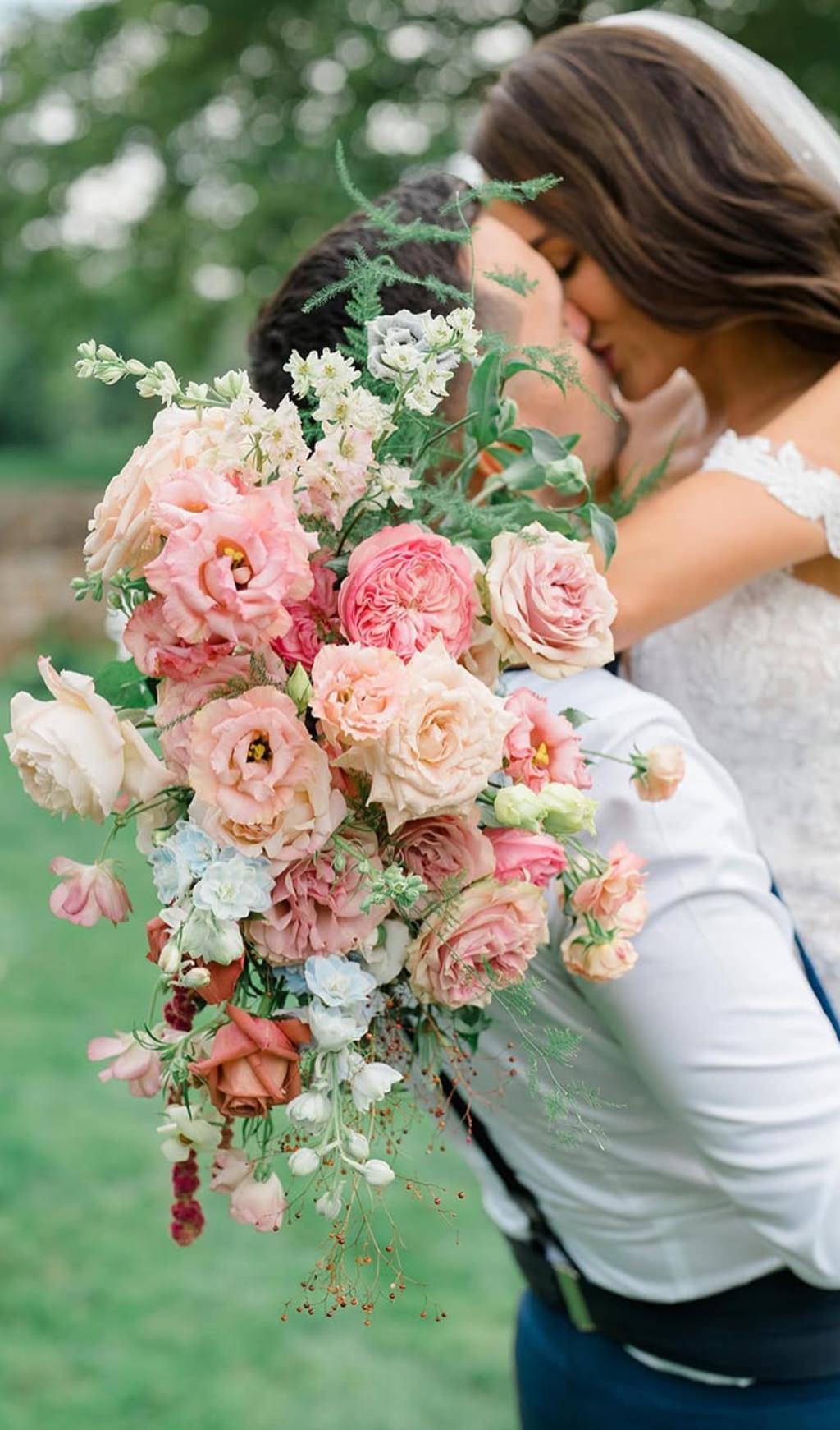 A gorgeous summer wedding bouquet for the bride with pink and peach flowers