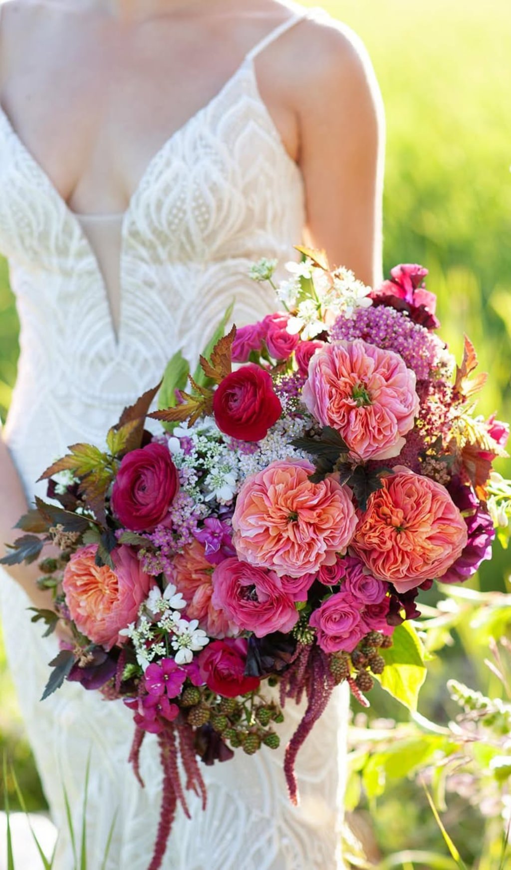 A bold summer bridal bouquet with pink and purple flowers