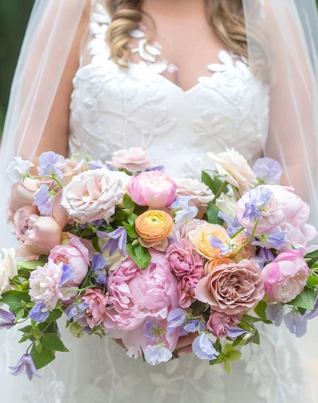 A big pink and purple summer bridal bouquet