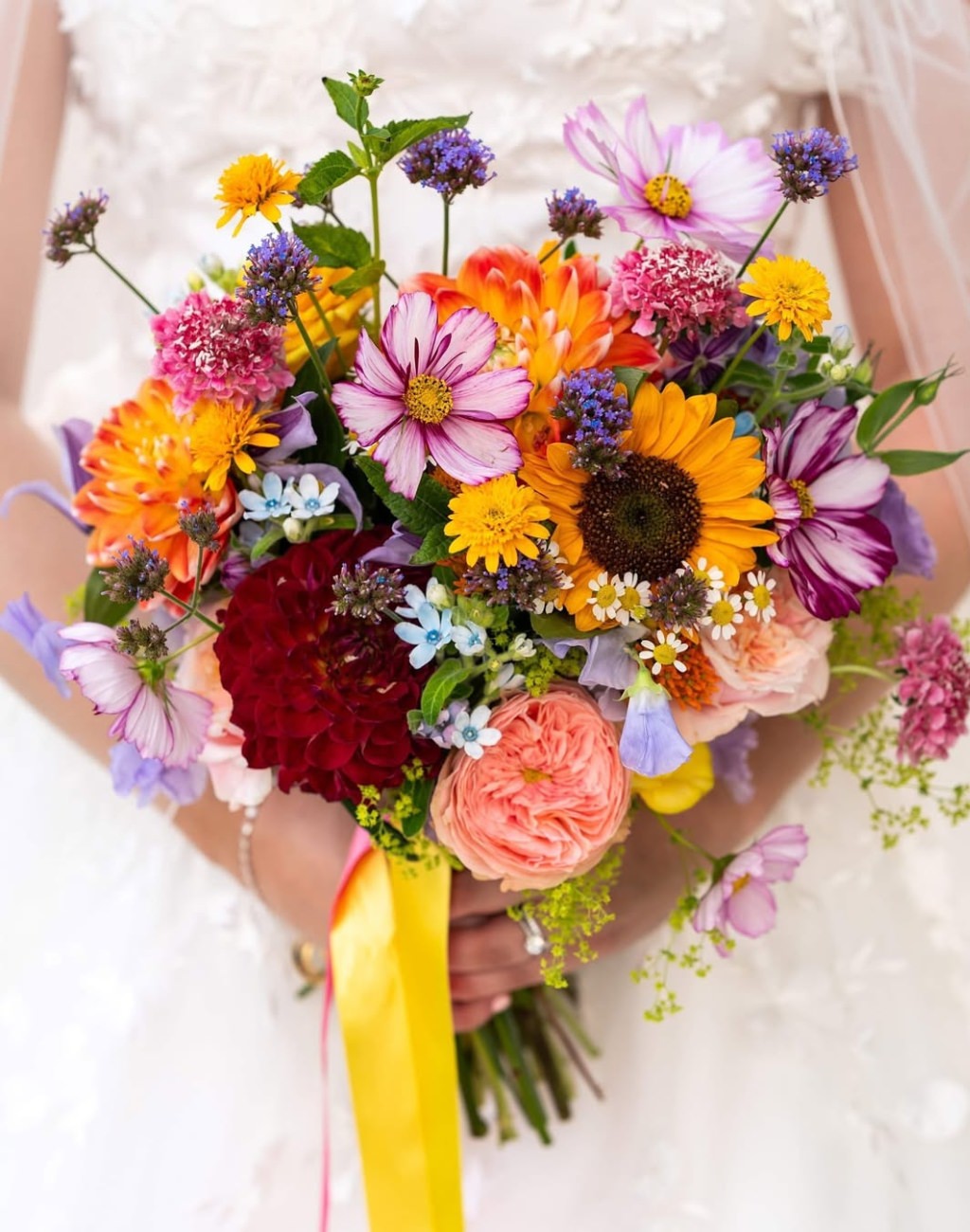 A big summer wedding bouquet for the bride with lots of wildflowers and colors