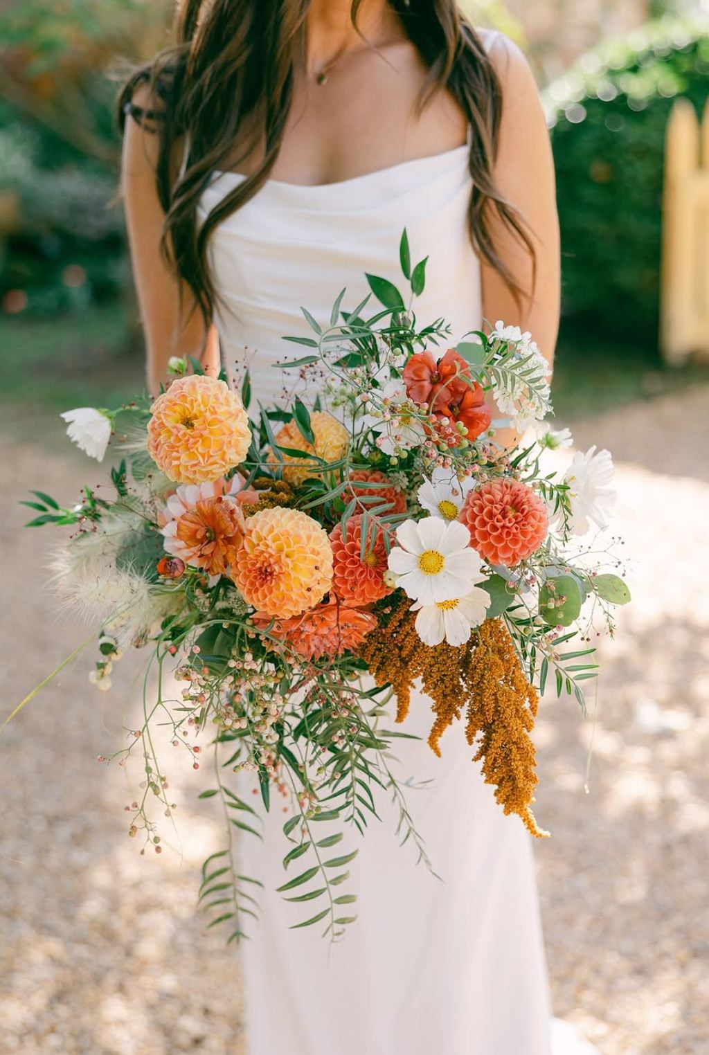 A stunning fall wedding bouquet with orange flowers