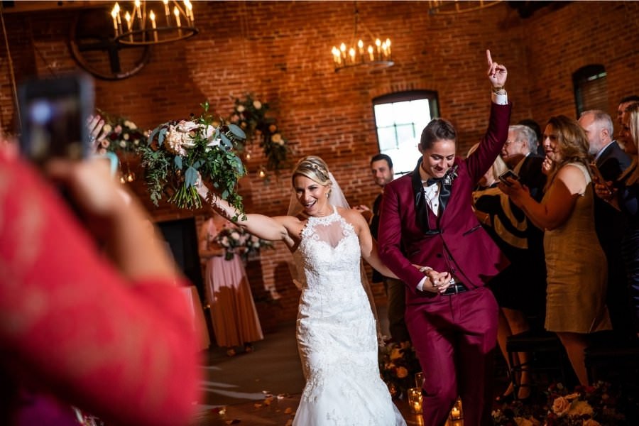 Two brides having fun at their wedding
